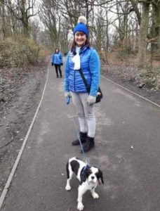 Bailey with his foster mum walking in the woods